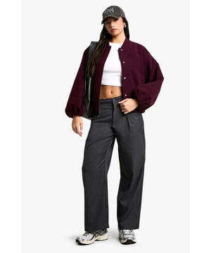 Low-rise design for a trendy silhouette
        Distinctive distressed waistband detail
        Wide leg cut for a relaxed, comfortable fit
        Button and zip fastening for secure closure
        Versatile style suitable for various casual occasions
    
    Make a bold statement with these eye-catching low-rise trousers from Boohoo. The standout feature is the uniquely distressed waistband, adding an edgy twist to your look. The wide-leg silhouette offers both comfort and style, perfect for the fashion-forward woman who values self-expression. Pair these trousers with a cropped top and oversized jacket for a balanced ensemble that captures the essence of contemporary street style. Whether you're heading to a casual lunch with friends or a laid-back evening out, these trousers will ensure you stand out from the crowd. The versatile design allows for easy styling with trainers for a relaxed daytime look or dressed up with heels for a more polished appearance. Embrace the blend of comfort and cutting-edge fashion with these must-have trousers that reflect the latest trends while maintaining a practical edge for everyday wear.