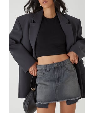 Crafted from pure cotton denim for ultimate comfort and durability
        Distinctive exposed pocket lining detail for an edgy, deconstructed look
        Raw-edge hem creates a perfectly undone finish
        Classic five-pocket design offers practical storage
        Mini length showcases legs whilst maintaining a casual vibe
    
    This MissPap denim mini skirt brings attitude to your casual wardrobe with its distinctive exposed pocket lining that adds an unconventional twist to a timeless silhouette. The raw-edge hem delivers that coveted lived-in aesthetic that pairs brilliantly with everything from crop tops to oversized shirts. Style with a fitted black top and trainers for daytime coffee dates, or transform your look for evening drinks with a halterneck bodysuit and strappy heels. The versatile design works wonderfully for family barbecues or festival outings when layered with a lightweight jacket. This mini skirt sits comfortably at the waist and features traditional denim detailing that complements its contemporary design elements - making it an essential piece for those who want to showcase their fashion-forward sensibility whilst maintaining effortless comfort.