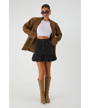Playful puff ball ruffle hem adds a flirty finish to this denim mini skirt
        High-waisted design creates a flattering silhouette
        Classic five-pocket styling for practicality
        Slight stretch in the fabric ensures comfortable movement
        Mini length perfect for showcasing your legs
    
    Make a statement with this eye-catching Puff Ball Denim Mini Skirt from MissPap. The distinctive bubble hem ruffle creates a fun, feminine silhouette that's perfect for turning heads. Style with a fitted bodysuit as shown for a balanced look that highlights the skirt's playful design. For daytime outings, pair with trainers and a cropped jacket, or transform for evening with heeled boots and statement jewellery. This versatile piece works brilliantly for brunches with the girls, casual shopping trips, or relaxed evening drinks. The high-waisted cut is particularly flattering when worn with tucked-in tops, creating a defined waistline. The cotton-rich fabric offers just enough stretch to keep you comfortable whilst maintaining that classic denim structure that holds its shape throughout the day.