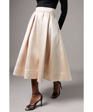 Elegant midi skirt featuring structured pleats for a sophisticated silhouette
        High-waisted design with a flattering wide waistband
        Graceful A-line shape that creates beautiful movement when walking
        Midi length falling approximately 127cm from waist to hem
        Fully lined for comfort and a luxurious drape
    
    This beautifully crafted twill midi skirt presents the perfect canvas for your most memorable occasions. The structured pleats create architectural interest whilst maintaining a feminine fluidity that moves gracefully as you walk. As shown, pair with an off-shoulder top for sophisticated elegance, or style with a crisp blouse for a more traditional ensemble. The high waistband accentuates your natural silhouette, whilst the midi length offers versatility for various formal settings. Perfect for weddings, the races or graduation ceremonies, this skirt can be dressed up with strappy heels and statement jewellery for daytime events, or complemented with a tailored jacket for evening affairs. The timeless design ensures this Coast piece will remain a cherished addition to your occasion wardrobe for seasons to come.
