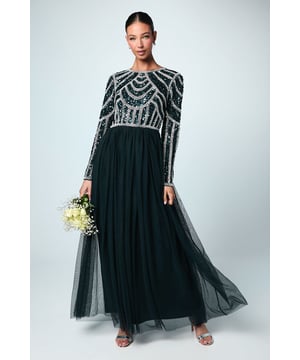 If a showstopping bridesmaid gown is what you're looking for, you're in the right place. Featuring a bodice swathed in dazzling sequins that glimmer in an art-deco pattern under the light, this design is finished by a delicate tulle skirt, adding to the sophisticated, old-time glamour aesthetic. Made from embellished sequins: exquisitely ornated with hand-sewn beads, this luxurious fabrication has a heavyweight feel, encasing your figure for a sculptural silhouette. Every unique pattern is created exclusively in-house by a team of artists. Level of stretch: none. This dress fastens with a rear concealed zip.This style is part of the Coast Honoured Collection, a dedicated range of never out-of-stock, bridesmaid dresses guaranteed to favour every member of your bridal party. Available in a selection of bestselling colour palettes, perfect for mix-and-match groups.