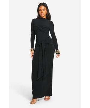 Striking twist-detail at the waist for a flattering silhouette
        Floor-sweeping maxi length for dramatic elegance
        Long sleeves and slash neckline offer versatile styling options
        Figure-hugging ITY jersey fabric with gentle stretch
        Gathered design creates a luxurious drape effect
    
    Make a lasting impression with this show-stopping maxi dress from Boohoo. The eye-catching twist detail at the waist creates a stunning focal point, accentuating your curves and adding a touch of sophistication. Perfect for those nights out when you want to turn heads, this dress effortlessly combines comfort with high fashion. Style it with strappy heels and statement earrings for a glamorous club look, or dress it down with metallic flats and a clutch for drinks with the girls. The versatile slash neckline allows for various jewellery options, while the long sleeves provide coverage without compromising on style. Whether you're dancing the night away or enjoying cocktails at a rooftop bar, this dress will ensure you're the centre of attention in all the right ways.