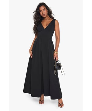 Textured crepe fabric adds subtle dimension and visual interest to this skater-style maxi dress
        Flattering plunge neckline creates an elegant focal point for evening occasions
        Sleeveless design offers comfort for dancing the night away
        Full skater skirt with structured pleating creates a dramatic silhouette
        Floor-length maxi cut makes a bold statement for special nights out
    
    Make an entrance in this striking skater maxi dress from Boohoo. The textured crepe fabric drapes beautifully whilst maintaining structure, creating a flattering silhouette that moves gracefully as you walk. The plunge neckline adds a touch of allure without overwhelming, perfect for evening cocktails or club nights. Style with strappy heels and statement jewellery as seen on our model for maximum impact, or dress down with a cropped jacket and chunky heels for drinks with friends. The versatile design transitions effortlessly from bar to dancefloor, making it an essential addition to your going-out wardrobe. For cooler evenings, layer with a fitted blazer and clutch bag to maintain the dress's elegant lines whilst adding practicality.