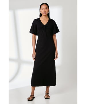 Elegant V-neckline with distinctive gathered detail creating a sophisticated drape
        Relaxed flutter sleeves for graceful movement and enhanced comfort
        Crafted from soft, breathable cotton jersey fabric that maintains its shape throughout wear
        Midi length with a subtle back split for ease of movement
        Clean-lined silhouette offering a flattering fit for various body types
    
    This Principles jersey midi dress combines timeless elegance with contemporary comfort. The distinctive neck detail creates visual interest while the relaxed flutter sleeves add a touch of feminine charm. The streamlined silhouette skims the body beautifully, making it an ideal choice for formal occasions that demand sophistication. Style with strappy heeled sandals and a clutch for weddings or race day events, or dress down with flat leather sandals for elegant daytime gatherings. For cooler evenings, layer with a tailored blazer and add statement jewellery to enhance the neckline detail. The versatile design transitions effortlessly from day to evening, whilst the cotton jersey construction ensures you remain comfortable throughout any occasion. This dress represents the perfect balance of refinement and wearability that Principles is known for.