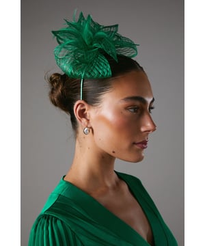 Exquisite open weave design with delicate bow and feather detailing
Lightweight and airy fascinator crafted from fancy fabric
Headpiece features a slender, curved headband for a secure fit
Intricate weave pattern creates a captivating textural effect
Versatile accessory to elevate your ensemble for formal occasions

Radiate sophistication and elegance with this stunning fascinator from Coast. The open weave design, adorned with a delicate bow and feather embellishments, exudes a refined and feminine aesthetic. Crafted from a lightweight and airy fancy fabric, this headpiece is the perfect accompaniment to your formal attire, whether you're attending a wedding, the races, or a graduation ceremony. Its slender, curved headband ensures a secure and comfortable fit, allowing you to confidently embrace the occasion. Style this versatile fascinator with a tailored dress or a chic jumpsuit for a polished and sophisticated look that commands attention.