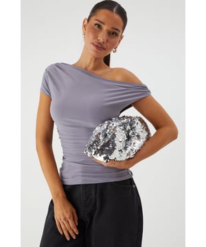 Eye-catching all-over sequin design that catches the light as you move
        Slouchy, soft-structured silhouette for effortless styling
        Secure zip closure to keep your essentials safe
        Chain strap detail for versatile carrying options
        Compact yet spacious enough for night-out essentials
    
    Make a statement with this dazzling Slouchy Sequin Clutch Bag from MissPap. The perfect companion for your night-out adventures, this bag combines practicality with head-turning style. Pair with a sleek bodycon dress or an off-shoulder ensemble for maximum impact at the club. The slouchy design offers a relaxed yet glamorous aesthetic that works brilliantly when you're hitting the town with friends. Versatile enough to complement both minimalist and bold outfits, this clutch transitions seamlessly from pre-drinks to dancefloor. The chain detail allows you to carry it as a shoulder bag when you need your hands free for drinks, while the secure zip closure ensures your phone, cards and lipstick stay safely tucked away as you dance the night away. This bag doesn't just hold your essentials-it becomes an integral part of your going-out look.
