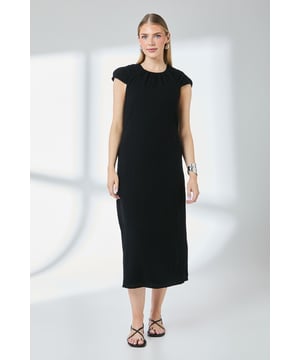Elegant column silhouette midi dress with a flattering straight cut
        Delicate gauze fabric texture provides a lightweight, breathable feel
        Subtle gathering detail at the round neckline adds feminine interest
        Cap sleeves offer comfortable coverage whilst maintaining a fresh look
        Fully lined with cotton for comfort and opacity throughout the day
    
    This versatile Principles midi dress combines effortless style with day-long comfort. The clean column shape creates a refined silhouette that works beautifully for various daytime occasions. Style with minimal strappy sandals and statement earrings for casual gatherings, or pair with a denim jacket and trainers for weekend brunches. The textured gauze fabric drapes beautifully whilst the cotton lining ensures a comfortable fit against the skin. For cooler days, layer with a lightweight cardigan or cropped jacket. The midi length makes this piece particularly suitable for family events or casual garden parties where you want to look polished yet relaxed. Accessorise with a structured cross-body bag and simple bangle to complete this understated yet sophisticated daywear ensemble.