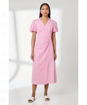 Elegant wrap design with D-ring fastening for a secure and adjustable fit
        Charming puff sleeves add a touch of feminine flair to this daytime dress
        Crafted from breathable cotton poplin for all-day comfort
        Midi-length silhouette with a flattering wrap front detail
        Fully lined with cotton for a smooth, comfortable feel against the skin
    
    This striped cotton poplin wrap dress from Principles combines timeless style with modern detailing. The wrap design creates a flattering silhouette that suits various body types, while the D-ring fastening adds both visual interest and practical adjustability. Style this versatile piece with white leather sandals as shown for casual daytime outings, or dress it up with espadrille wedges for garden parties and family gatherings. The breathable cotton construction makes it ideal for warm weather occasions, from weekend brunches to holiday strolls. For cooler days, layer with a lightweight denim jacket and accessorise with simple gold-toned jewellery to complement the dress's refined aesthetic. This easy-care garment transitions effortlessly from day to evening, making it a wardrobe essential for the fashion-conscious woman.