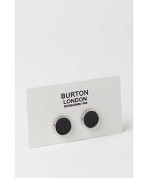 Sleek circular design with contrasting black centre and polished silver rim
        Secure toggle fastening for reliable wear throughout the day
        Versatile size that complements both standard and French cuffs
        Classic Burton craftsmanship with attention to detail
        Timeless monochrome palette that pairs with any formal shirt
    
    These sophisticated cufflinks offer the perfect finishing touch to your formal attire. The striking contrast between the black centre and silver surround creates a refined aesthetic that works brilliantly with a range of shirt colours. Ideal for adding a subtle touch of personality to your suit, these cufflinks can be styled with a crisp white shirt and navy blazer for important meetings, or paired with a grey suit for wedding celebrations. The understated design makes them appropriate for various smart occasions, from business functions to evening events. For a complete look, match with a silver-toned watch and a classic Burton suit. These cufflinks reflect a man who appreciates traditional style with contemporary appeal - perfect for the gentleman who values both function and form in his accessories.