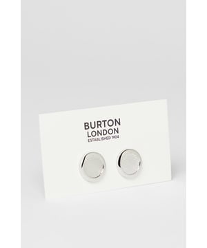 Elegant round design with textured detailing for a sophisticated finish
        Secure toggle fastening ensures cufflinks stay in place throughout the day
        Polished silver-tone metal creates a versatile accessory for formal attire
        Subtle textured pattern adds distinctive character without being overstated
        Classic Burton craftsmanship that complements any formal shirt
    
    These detailed cufflinks offer the perfect finishing touch to your formal ensemble. The textured circular design presents a refined aesthetic that works brilliantly with crisp white shirts or adds character to coloured options. Ideal for important meetings, weddings, or sophisticated evening events, they provide just the right amount of polish without appearing ostentatious. Pair with a tailored Burton suit for a coordinated look, or use them to sharpen up a smart casual outfit when you want to make an impression. The timeless design ensures these cufflinks will remain a staple in your accessories collection, offering versatility across various occasions where you need to present a distinguished appearance. Their understated elegance makes them suitable for everything from job interviews to anniversary dinners.