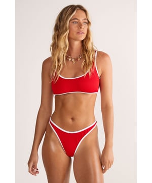 Turn heads. Feel vacation ready in our bikini, made in ribbed fabric, with a crop style top, and a high leg cut which elongates the leg. Pairs well with your fave sandals and a sarong for a look that demands attention at the poolside.  Ribbed Contrast Binding Crop Bikini Set High Quality Ribbed Fabric Statement High Leg Bikini Bottoms Flattering Crop Bikini Top Contrasting Detailing Easy Pull-On Design Model wears a size S (US size 6/UK size 10).