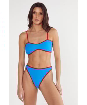 Striking contrast binding detail creates a bold, eye-catching look
        High leg cut design elongates the legs for a flattering silhouette
        Adjustable spaghetti straps for a customised fit
        Bandeau-style top offers stylish support with a modern edge
        Part of a coordinated two-piece set for a cohesive beach look
    
    Make waves this season in our Contrast Binding High Leg Bikini from Nasty Gal. This standout two-piece features a sleek bandeau-style top with thin adjustable straps and a high-cut bottom that showcases your curves with confidence. The bold contrast binding creates a sporty yet feminine aesthetic that's perfect for beach days and poolside lounging. Style with oversized sunglasses and a lightweight kimono for casual strolls along the shore, or pair with high-waisted linen trousers and sandals when heading to beachside restaurants. Whether you're planning a tropical getaway or simply soaking up the sun at your local lido, this bikini offers both comfort and head-turning style that will have you looking fabulous from sunrise to sunset.