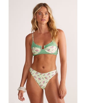 Charming mixed-print design featuring floral patterns and gingham detailing for a playful aesthetic
        Supportive underwire bikini top with adjustable spaghetti straps for customised fit and comfort
        Classic bikini bottoms with a flattering cut that sits comfortably on the hips
        Two-piece set allowing for mix-and-match styling options with other swimwear pieces
        Lined construction providing additional comfort and coverage for beach confidence
    
    Make a splash this season in this delightful Floral Gingham Mix Underwire Bikini Set from Nasty Gal. The charming combination of dainty florals and classic gingham creates a nostalgic yet contemporary look that's perfect for sunny getaways. The structured underwire top offers fantastic support whilst maintaining a feminine silhouette, ideal for both lounging poolside and taking a refreshing dip. Pair with oversized sunglasses and a wide-brimmed straw hat for ultimate resort chic, or throw on a lightweight cotton shirt and denim shorts when heading to beachside cafs. This versatile bikini set transitions effortlessly from lazy days soaking up the sun to coastal adventures, making it an essential addition to your holiday wardrobe. Complete the look with simple sandals and a roomy beach tote for a carefree summer ensemble.