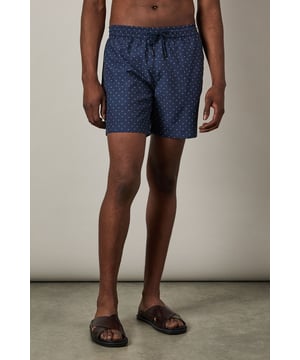 Stylish dash print design for a contemporary poolside look
        Quick-drying woven fabric for comfort in and out of the water
        Adjustable drawstring waist for a secure, customisable fit
        Mid-thigh length offering balanced coverage and freedom of movement
        Mesh lining for added comfort and support whilst swimming
    
    These Burton swim shorts combine practicality with classic style, perfect for the man who appreciates timeless design. The dash print adds subtle visual interest without being overly trendy, making these shorts a versatile addition to your holiday wardrobe. Style them as seen with a crisp white shirt for beachside lunches or evening drinks at the resort bar. For casual pool days, pair simply with your favourite sunglasses and sandals. The comfortable fit and practical design make these shorts ideal for everything from swimming laps to relaxing with a cold drink at a family barbecue. They'll take you effortlessly from the beach to a casual pub lunch with mates, offering the versatility that modern life demands without compromising on Burton's trusted quality and classic appeal.