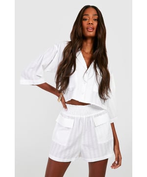 Textured fabric adds depth and visual interest
        Cropped shirt with functional pocket detail
        Collared neckline for a smart-casual look
        Relaxed fit shorts with elasticated waistband
        Versatile co-ord set for mix-and-match styling
    
    Make a statement with this chic textured crop shirt and shorts co-ord from Boohoo. Perfect for the fashion-forward woman who values both style and comfort, this set offers endless styling possibilities. The cropped shirt features a collared neckline and practical pocket detail, while the shorts boast a relaxed fit with an elasticated waistband for all-day ease. Ideal for casual outings or laid-back gatherings, this co-ord can be dressed up or down to suit your mood. Pair with trainers and a crossbody bag for a daytime look, or style with strappy sandals and statement jewellery for an evening out with friends. The textured fabric adds a touch of sophistication, making this set a versatile addition to your wardrobe that can transition seamlessly from family barbecues to impromptu catch-ups with mates.