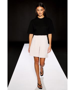 Sophisticated Bermuda shorts from the exclusive RUNWAY 1.8.1.8 collection
        Elegant crepe fabric with a smooth, refined finish
        High-waisted design with clean, tailored lines
        Practical side pockets for functionality and style
        Relaxed yet structured silhouette for a contemporary city aesthetic
    
    These City Style Bermuda Shorts from Warehouse's RUNWAY 1.8.1.8 collection present a refined take on warm-weather dressing. The tailored silhouette offers a sophisticated alternative to traditional occasion wear, perfect for summer soires and formal daytime events. Style with a crisp black top as shown for a striking monochromatic look that commands attention, or pair with a structured blazer and elegant blouse for race day sophistication. For evening occasions, team with a sequined top and strappy heels to showcase the shorts' versatility. The clean lines and contemporary cut make these Bermuda shorts an excellent choice for graduation ceremonies or garden parties where you wish to convey confidence with a fashion-forward edge. The crepe fabric ensures the shorts maintain their shape throughout wear, offering both comfort and elegance for the modern woman who appreciates understated luxury.