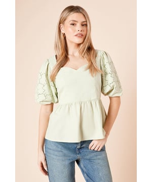 Charming sweetheart neckline creates a feminine silhouette
        Intricate cutwork detailing on the sleeves adds a touch of elegance
        Peplum-style waist creates a flattering shape
        Crafted from 100% cotton poplin for breathable comfort
        Elasticated back detail ensures a comfortable fit
    
    This Dorothy Perkins Cutwork Sleeve Poplin Blouse combines comfort with sophisticated style. The delicate cutwork pattern on the sleeves creates visual interest while the sweetheart neckline frames your dcolletage beautifully. Style with straight-leg jeans and white trainers for a casual brunch with friends, or dress it up with tailored trousers and ballet flats for family gatherings. The peplum silhouette skims over your waistline for a flattering fit that works for various body types. Perfect for those warm-weather occasions when you want to look put-together without sacrificing comfort. The cotton fabric ensures breathability throughout the day, making this blouse an ideal choice for baby showers or afternoon garden parties where you'll want to stay cool and collected while looking effortlessly chic.