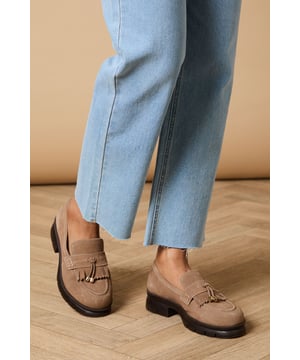 Crafted from soft suede with decorative tassel detailing for a classic finish
        Chunky sole provides excellent grip and all-day comfort
        Flat heel height (under 2cm) ideal for extended wear
        Traditional loafer silhouette with contemporary proportions
        Gold-tone hardware accent adds a subtle touch of sophistication
    
    The Brooke Suede Tassel Loafers from Oasis present the perfect blend of comfort and style for your everyday wardrobe. These versatile flats showcase charming tassel detailing that nods to traditional loafer design whilst maintaining a fresh, feminine appeal. Style them as seen with relaxed denim and a flowing blouse for casual weekend brunches, or pair with tailored trousers and a crisp shirt for a smart-casual office look. The chunky, durable sole offers practical wearability whilst the neutral tone ensures these loafers will complement virtually any outfit in your collection. Perfect for city exploring, shopping trips or casual gatherings where comfort cannot be compromised, these loafers will quickly become your go-to footwear choice for occasions that require both style and practicality.