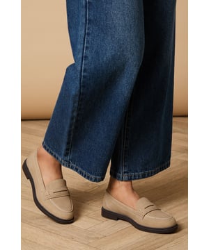 Classic penny loafer design with a contemporary faux suede finish
        Comfortable flat heel measuring between 0-2cm for all-day wearability
        Contrast stitching detail adds subtle visual interest
        Durable synthetic outsole provides reliable grip and longevity
        Versatile slip-on style with traditional penny slot detailing
    
    These Beech Faux Suede Penny Loafers from Oasis offer the perfect blend of timeless style and modern comfort. Pair them with wide-leg denim and an oversized white shirt for an effortlessly chic daytime look, or style with tailored trousers and a blouse for more polished occasions. The neutral tone makes these loafers incredibly versatile, working beautifully with floral dresses and skirts for a feminine touch that's quintessentially Oasis. Their flat design ensures comfort during family gatherings or weekend brunches, whilst the classic penny loafer silhouette adds a sophisticated element to casual ensembles. These shoes transition seamlessly from office to weekend, making them a wardrobe essential that will complement your existing collection whilst adding a refined finishing touch to any outfit.