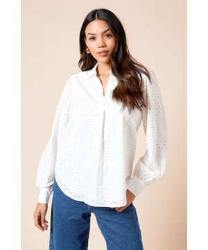 Elegant broderie anglaise pattern throughout for a delicate, feminine touch
        Relaxed overhead design with partial button placket for easy styling
        Classic collar adds a refined element to this casual piece
        Voluminous long sleeves with gathered cuffs create a flattering silhouette
        Crafted from 100% cotton for breathable comfort throughout the day
    
    This Dorothy Perkins Broderie Overhead Shirt combines timeless charm with modern versatility. The intricate broderie detailing adds texture and interest to this otherwise simple design, making it perfect for those who appreciate subtle sophistication. Style it as seen with relaxed wide-leg jeans and flat sandals for weekend brunches with friends, or tuck it into a flowing midi skirt for family gatherings. The overhead style offers effortless dressing while the cotton fabric ensures all-day comfort. For cooler days, layer under a lightweight cardigan or denim jacket without compromising on style. This shirt transitions beautifully from casual coffee dates to baby showers when paired with tailored trousers and ballet flats. A versatile wardrobe staple that works across seasons, offering the perfect balance of comfort and style for the fashion-conscious woman who values both trend and tradition.