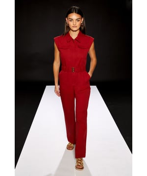 Sleeveless utility jumpsuit with structured collared neckline for a contemporary silhouette
        Practical chest pockets add functional detail and enhance the utility-inspired design
        Belted waist creates a flattering, defined shape whilst maintaining comfort
        Straight-leg cut offers ease of movement and a clean, modern line
        Crafted from 100% cotton woven fabric ensuring breathability and durability for all-day wear
    
    The RUNWAY 1.8.1.8 Utility Jumpsuit presents a bold statement piece perfect for the modern bride seeking an unconventional bridal celebration option. This regular-fit, one-piece wonder combines practicality with sophistication through its clean lines and structured design. Style with minimalist gold jewellery and flat sandals for a relaxed bridal luncheon, or transform for evening celebrations with statement earrings and heeled mules. The versatile nature of this jumpsuit makes it ideal for wedding-adjacent events like rehearsal dinners or post-ceremony brunches. The cotton construction ensures comfort throughout your special occasions, whilst the utility details reflect contemporary bridal trends that value both style and functionality. This jumpsuit offers the perfect balance of fashion-forward thinking and timeless appeal for the bride who dares to be different.