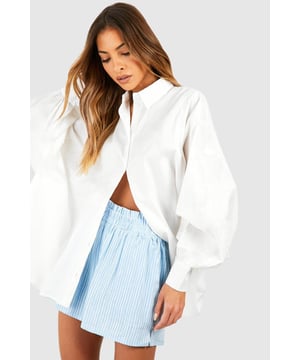 Refresh your wardrobe with this cotton shirt. A true staple, the humble cotton shirt goes with just about everything - and looks good, too! This shirt is made from a lightweight cotton, meaning it's both breathable and easy to wear, and is traditionally tailored with structured sleeves and collar. Dress it up with some wide-leg trousers and heels, or keep things easy-breezy by tucking it into your favourite pair of jeans. Either way, you'll be good to go in this classic shirt.Style: Plain ShirtFabric: Cotton PoplinNeckline: CollaredSleeve Length: Long Sleeve
