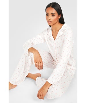 Tall-fit pyjama set for extra comfort and coverage
        Charming all-over print design
        Long-sleeved button-up top with notched collar
        Relaxed-fit trousers with elasticated waistband
        Soft jersey fabric for ultimate lounging comfort
    
    Indulge in the perfect blend of style and comfort with this delightful tall pyjama set from Boohoo. Designed for the fashion-forward woman who values both trendy looks and cosy nights in, this set is a must-have addition to your nightwear collection. The long-sleeved top features a classic button-up front and notched collar, offering a touch of sophistication to your bedtime routine. Paired with relaxed-fit trousers, this ensemble ensures unrestricted movement for a restful night's sleep. The charming all-over print adds a playful element, making this set ideal for lazy weekend mornings or impromptu flatmate film nights. Crafted from soft jersey fabric, it's the ultimate choice for those who appreciate comfort without compromising on style. Whether you're catching up on beauty sleep or enjoying a leisurely breakfast in bed, this pyjama set is your ticket to effortless nighttime chic.
