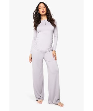 Soft, stretchy fabric with added elastane for ultimate comfort during pregnancy and nursing
        Stylish button-front detail on the top for easy nursing access
        Wide-leg trousers with relaxed fit to accommodate your changing shape
        Long sleeves for extra warmth and coverage
        Coordinated two-piece set designed specifically for maternity and nursing needs
    
    This versatile maternity loungewear set from Boohoo combines practicality with style for mums-to-be and new mothers alike. The thoughtfully designed button placket allows for discreet and convenient nursing, whilst the stretchy fabric gently accommodates your growing bump. The wide-leg trousers offer unrestricted movement and all-day comfort whether you're relaxing at home or popping out for coffee with friends. Perfect for casual family gatherings or lazy weekends, this set can be paired with trainers and a denim jacket for quick errands or styled with cosy slippers and a soft cardigan for ultimate home comfort. The coordinated design takes the guesswork out of maternity dressing, ensuring you look put-together with minimal effort during this special time.