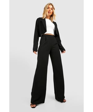Wide leg silhouette for a contemporary look
        High-waisted design for a flattering fit
        Smooth Liverpool Crepe fabric with stretch for comfort
        Versatile style suitable for various occasions
        Floor-skimming length for a dramatic effect
    
    These Basic Jersey Wide Leg Trousers from Boohoo are a wardrobe essential for the fashion-forward woman. The wide leg silhouette creates a striking look that's perfect for the office or after-work drinks. Pair with a crisp white shirt and blazer for a polished workwear ensemble, or dress them up with a silky camisole and strappy heels for evening events. The high-waisted design cinches in at the smallest part of your waist, creating a flattering silhouette. The Liverpool Crepe fabric offers a touch of stretch for all-day comfort, while the floor-skimming length adds drama to your stride. These trousers are a versatile piece that can be styled countless ways, making them a must-have for any fashion-savvy individual looking to make a statement in the workplace and beyond.
