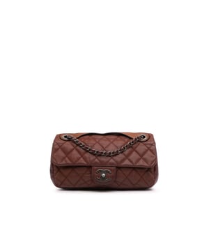 This satchel features a quilted lambskin leather body a flat leather top handle a leather woven chain link strap a front flap with CC turn lock closure and an interior zip pocket.Brand: ChanelCondition: Pre-lovedType: SatchelRating: B+Main Material: LeatherDimensions (LxWxD): 15x26.5x8Strap Drop: 28.5Comments: Lock Scratched. Exterior Handle Worn. Interior Lining stained with Other. Practical Attachment Scratched. Exterior Side Cracked Worn. Item has an odor of Other.