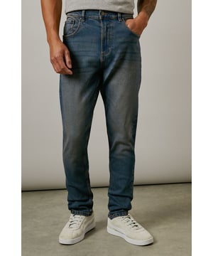 Slim fit design with a contemporary vintage wash finish
        Crafted with stretch cotton for enhanced comfort and movement
        Classic five-pocket styling with traditional contrast stitching
        Versatile mid-rise waistband with belt loops
        Tapered leg silhouette that sits neatly on trainers
    
    These Burton vintage wash jeans combine timeless style with modern comfort. The slim fit contours to your body without feeling restrictive, thanks to the added stretch that moves with you throughout the day. Perfect for casual outings, these jeans pair brilliantly with a simple t-shirt as shown, or layer with a casual shirt and lightweight jacket for pub gatherings with mates. The vintage wash treatment gives them a lived-in look that improves with wear, making them ideal for weekend sporting events or relaxed family gatherings. The versatile design works equally well with trainers for daytime wear or can be dressed up with desert boots for evening socials. A wardrobe essential that offers both practicality and style for the modern man who values classic appeal over fleeting trends.