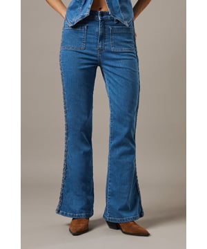 High-waisted design for a flattering silhouette that accentuates the waistline
        Distinctive patch pockets at the front add a retro-inspired detail
        Classic bootcut shape that gradually widens from the knee to the hem
        Cotton fabric offers breathable comfort for all-day wear
        Versatile mid-wash denim that pairs effortlessly with casual and smart-casual looks
    
    Channel effortless 70s-inspired style with these high-waisted bootcut jeans from Warehouse. The distinctive front patch pockets add a vintage touch to this contemporary wardrobe staple. Style with a tucked-in ruffled camisole and flat shoes for a relaxed daytime look, or dress them up with a fitted blouse and block heels for casual gatherings. The flattering bootcut silhouette balances proportions beautifully, making these jeans ideal for various body types. Perfect for family brunches, weekend shopping trips or casual Fridays at the office. The cotton construction ensures these jeans will maintain their shape whilst providing comfort throughout the day. A true wardrobe hero that offers endless styling possibilities for the confident, modern woman.