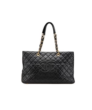 The Grand Shopping Tote features a caviar leather body a leather woven chain link straps with leather guard an open top an exterior back slip pocket and interior zip and slip pockets.Brand: ChanelCondition: Pre-lovedType: Tote BagRating: B+Main Material: LeatherDimensions (LxWxD): 26x41x14Strap Drop: 24Comments: Exterior Back Creased Out Of Shape. Exterior Back stained with Other. Exterior Bottom stained with Other. Exterior Corners Worn. Embellishment Scratched. Exterior Front Creased Out Of Shape. Exterior Front stained with Other. Exterior Handle Creased Worn. Exterior Handle stained with Other. Interior Pocket stained with Other. Interior Lining stained with Other. Exterior Pocket stained with Other. Practical Attachment Scratched. Exterior Side stained with Other. Item has an odor of Musty. Exterior Top stained with Other. Zipper Scratched.