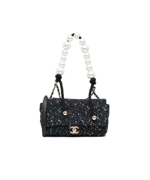 This flap bag features a tweed body with sequin details a faux pearl handle a leather woven chain shoulder strap with leather guard a front flap with interlocking Cs and twist lock closure and an interior zip pocket.Brand: ChanelCondition: Pre-lovedType: SatchelRating: B+Main Material: fabricDimensions (LxWxD): 16x23x7Strap Drop: 52Handle Drop: 20Comments: Exterior Back Creased Worn. Exterior Bottom Worn. Lock Scratched. Exterior Corners Worn. Embellishment Scratched. Exterior Front Loose Stitching Worn. Exterior Handle Worn. Interior Pocket Worn. Interior Lining Scratched Worn. Practical Attachment Scratched. Exterior Side Worn. Exterior Top Worn. Zipper Scratched.