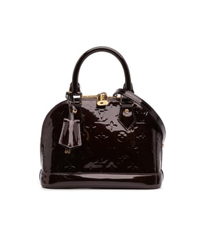 The Alma BB features a monogram vernis leather body a clochette rolled leather handles a top zip-around closure and an interior slip pocket.Brand: Louis VuittonCondition: Pre-lovedType: SatchelRating: B+Main Material: LeatherDimensions (LxWxD): 17.5x23.5x11.5Strap Drop: 56.5Handle Drop: 10.5Comments: Exterior Bottom Scratched. Exterior Handle Scratched. Interior Lining stained with Other. Practical Attachment Scratched. Exterior Top stained with Other. Zipper Scratched.
