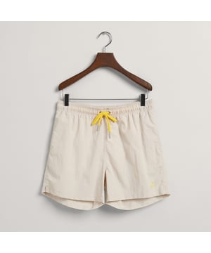 Crafted with quality and attention to detail  these shorts offer a comfortable fit and quick-drying fabric. With their classic design and minimal branding  they are perfect for both swimming and casual summer outings.