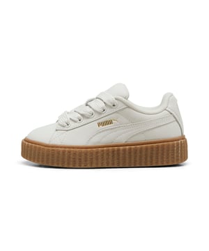 PRODUCT STORY: Rihanna and PUMA get down to earth with the Creeper Phatty Earth Tone. Made with luxe, high-quality nubuck, the new FENTY x PUMA Creeper Phatty stands out while blending in with soft, natural colors. Touches of gold and the classic Creeper sole elevate this new drop from Rihanna.DETAILS: Leather upper; Lace closure; Ribbed gum midsole; Gum outsole; PUMA Kids: Recommended for young kids between 4 and 8 years.