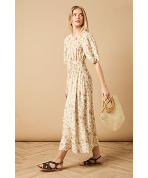 Beautifully shirred bodice creating a flattering silhouette
        Charming puff sleeves with elasticated cuffs for a feminine touch
        Elegant midi length perfect for day-to-evening versatility
        Crew neckline offering a classic, sophisticated finish
        All-over print design that adds visual interest to your wardrobe
    
    This delightful Oasis midi dress showcases the perfect blend of comfort and style with its intricately shirred bodice and charming puff sleeves. The flowing midi length creates an effortlessly feminine silhouette that's ideal for casual daywear occasions. Style with chunky sandals as shown for a contemporary daytime look, or pair with white trainers and a denim jacket for weekend brunches and family gatherings. The versatile design makes it perfect for garden parties or casual coffee dates with friends. For cooler days, layer with a lightweight cardigan and ankle boots to maintain that effortless charm. The shirred detailing adds texture while the all-over print ensures this piece will become a standout favourite in your wardrobe rotation.