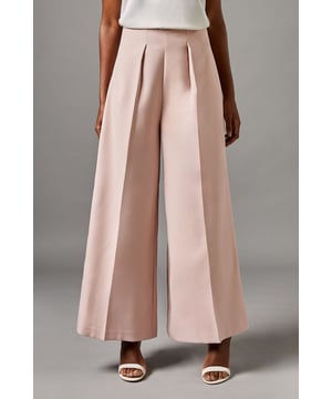 Elegant crop trousers featuring sophisticated front pleats for added dimension and structure
        Wide-leg silhouette offering graceful movement and contemporary sophistication
        Flattering high-waist design that accentuates the natural waistline
        Crafted from crepe fabric with a touch of stretch for comfort throughout the day
        Versatile 72cm inside leg length, perfect for showcasing statement footwear
    
    These exquisite crop trousers from Coast present a masterclass in refined occasion dressing. The architectural pleating creates a fluid silhouette that commands attention whilst maintaining an air of understated elegance. Style with the coordinating top as shown for a modern take on formal attire, or pair with a delicate lace blouse for traditional sophistication. The wide-leg design offers both comfort and visual impact, making these trousers ideal for summer weddings, race day events or graduation ceremonies. Complete your ensemble with strappy heeled sandals and a structured clutch for a polished finish. The clean lines and impeccable tailoring reflect Coast's commitment to creating pieces that help you look your absolute best for those moments that matter most.