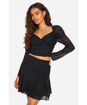 Chiffon mini skirt with side ruching for a flattering silhouette
        Flirty flared hem adds movement and style
        High-waisted design for a leg-lengthening effect
        Versatile piece perfect for day-to-night transitions
        Lightweight and breathable fabric ideal for dancing the night away
    
    Make a statement on your next night out with this chic chiffon mini skirt. The side ruching detail creates a figure-hugging fit that flatters your curves, while the flared hem adds a playful touch to your ensemble. Pair it with the matching crop top for a coordinated look that's sure to turn heads. For a bold night-time outfit, team it with strappy heels and statement earrings. Alternatively, dress it down for daytime drinks by pairing it with a casual tee and trendy trainers. The lightweight fabric ensures comfort as you move from bar to dance floor, making this skirt a versatile addition to your going-out wardrobe. Whether you're meeting friends for cocktails or hitting the club, this mini skirt is your ticket to effortless style.