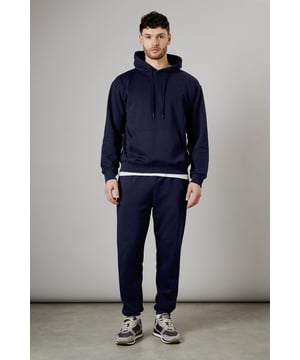 Classic overhead design with spacious front pocket for everyday essentials
        Soft jersey fabric offers comfort and warmth for casual wear
        Ribbed cuffs and hem provide a secure, comfortable fit
        Roomy hood with adjustable cords for additional weather protection
        Versatile layering piece that pairs effortlessly with matching joggers or casual trousers
    
    This Burton overhead hoody delivers timeless casual style with practical functionality. The relaxed silhouette offers ample room for movement without sacrificing shape, making it perfect for weekend activities or post-work relaxation. As shown, it creates a coordinated look when paired with matching joggers and trainers for a contemporary sportswear aesthetic. Layer it over a simple t-shirt for pub gatherings with mates, or throw it on after a gym session for instant comfort. The durable construction stands up to regular wear, whilst the classic design ensures it remains a wardrobe staple season after season. Ideal for watching the match, casual family gatherings, or simply lounging at home, this hoody strikes the perfect balance between comfort and understated style that Burton's discerning customer appreciates.