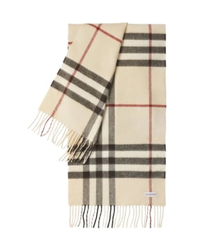Wrap yourself in luxury with the Burberry Giant Check Cashmere Scarf! Made from 100% cashmere, this scarf is not only soft and cozy, but it also exudes elegance and sophistication. Measuring 168x30cm, it's the perfect size for draping over your shoulders or tying around your neck. Elevate any outfit with this iconic check pattern in a timeless beige color. Experience the ultimate in comfort and style with Burberry