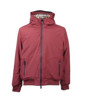 Elevate your outerwear collection with the Aquascutum Active Hooded Burgundy Jacket. This technical masterpiece combines classic styling with performance features, showcasing the premium "Shell" fabric construction. The sophisticated shirt collar design merges timeless aesthetics with contemporary function, while the luxurious Primaloft® 100% polyester padding ensures exceptional warmth without bulk. Perfect for the discerning gentleman who demands both style and substance