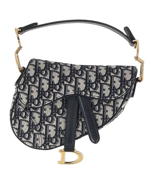 VINTAGE, RRP AS NEW
The Dior Mini Saddle Oblique Shoulder Bag in navy blue canvas brings timeless elegance with a modern edge, featuring the iconic Dior Oblique jacquard and signature saddle silhouette. Compact yet statement-making, it’s perfect for day-to-night styling with a luxurious Parisian touch. **Style tip:** Pair it with high-waisted jeans and a crisp white blouse or drape it over a tailored blazer for a chic, effortless finish.

 Dior Mini Saddle Oblique Shoulder Bag in Navy Blue Canvas

Condition: Excellent
Signs of wear: No retail tag, No visible sign of wear., 
Packaging: None
Color: Navy blue
Material: Canvas 
Size: One Size | One Size
Measurements: Width: 35; Height: 150; Length: 180
SKU: NAPPUGBBA492830W
