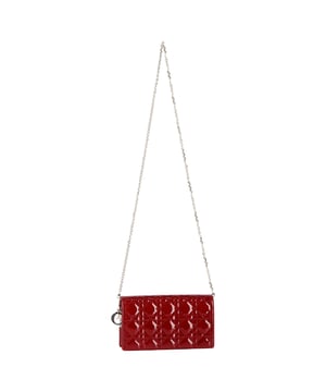 VINTAGE, RRP AS NEW
Crafted from glossy cherry red patent calfskin, the Lady Dior Pouch showcases the house’s signature Cannage stitching and refined detailing. Adorned with detachable D.I.O.R. charms and a removable chain strap, this elegant accessory offers versatile styling—wear it as a clutch, a crossbody, or carry its components separately. Inside, discover a thoughtfully designed interior with two removable elements: a zip pouch and a cardholder with eight slots and a slip pocket. A timeless piece that blends Dior’s heritage with functional modernity.


Dior Lady Dior Pouch with Chain in Red Patent Cannage Calfskin Leather
Condition: Excellent
Signs of wear: No retail tag, No visible sign of wear., 
Packaging: Box, Dust bag
Color: Red 
Material: Leather | patent leather
Size: One Size | One Size
Measurements: Width: 50; Height: 125; Length: 215; Handle drop: 520; Strap length: 1200
SKU: NAPPUGBBA480587W
