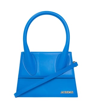 Elevate your accessory collection with the Jacquemus Le Grand Chiquito Blue Bag, a statement piece that combines luxury and contemporary design. This coveted women's handbag features the iconic Chiquito silhouette in a stunning blue hue that adds a pop of color to any outfit. Meticulously crafted with premium materials, this fashionable accessory offers both style and functionality for the modern woman. Perfect for special occasions or adding flair to everyday ensembles, this designer bag is an investment piece that will turn heads and spark conversations. Dimensions: 18x13x7.5 cm. 100% Leather Made In Italy
