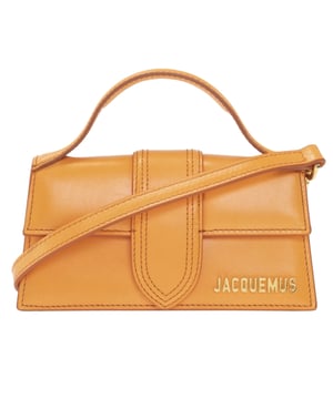 Elevate your style with the Jacquemus Le Bambino Orange Bag, a statement accessory that commands attention. This vibrant orange masterpiece from the coveted Jacquemus collection combines compact design with maximum impact. Perfect for day-to-night transitions, its distinctive silhouette and premium craftsmanship ensure you'll stand out from the crowd. Don't just carry a bag-make a fashion declaration that speaks volumes about your impeccable taste. Dimensions: 17.5 x 9.5 x 5.5 cm. 100% Leather Made In Italy