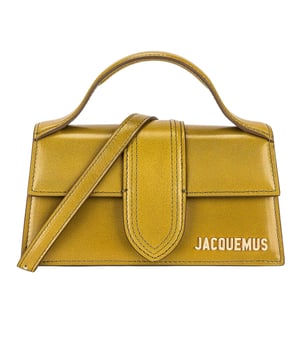Elevate your accessory collection with the Jacquemus Le Bambino Light Khaki Green Bag. This exquisite designer piece combines understated elegance with contemporary style, featuring the signature Jacquemus minimalist aesthetic in a versatile khaki green shade. Perfect for day-to-night transitions, this compact yet statement-making bag offers both fashion-forward appeal and practical functionality. A must-have addition for the modern woman who appreciates luxury craftsmanship and distinctive design. 17.5 x 9.5 x 5.5 cm. 100% Leather Made In Italy