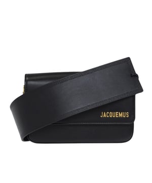 Jacquemus Le Carinu Black Bag is the epitome of contemporary luxury that every fashion-forward woman deserves. This sleek designer accessory combines minimalist French aesthetics with practical functionality. The sophisticated black finish ensures versatility with any outfit, from casual daywear to elegant evening ensembles. Crafted with meticulous attention to detail, this coveted piece instantly elevates your style credentials while offering the perfect size for your essentials. Don't miss the opportunity to own this season's must-have accessory. Dimensions: 12 x 18.5cm. 100% Leather Made In Spain