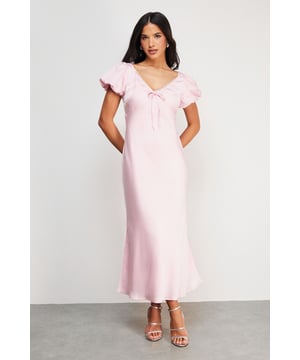 Elegant satin midi tea dress with delicate lace insert detailing
        Feminine puff sleeves with subtle volume for a romantic silhouette
        Flattering V-neckline with charming bow tie detail
        Flowing midi length design that falls gracefully to mid-calf
        Fully lined for comfort and a smooth, refined drape
    
    This enchanting Warehouse tea dress combines vintage-inspired charm with contemporary styling. The satin fabric creates a lustrous finish that catches the light beautifully, whilst the puff sleeves and lace inserts add a touch of feminine flair. Style with strappy metallic sandals as seen on our model for daytime gatherings, or dress down with white trainers and a denim jacket for weekend brunches. The versatile midi length works wonderfully for family celebrations or garden parties-simply add delicate jewellery and a woven clutch to complete the look. For cooler days, layer with a lightweight cardigan and ankle boots for an effortlessly chic ensemble that transitions seamlessly from day to evening. This dress embodies confident femininity with its subtle details and timeless silhouette.